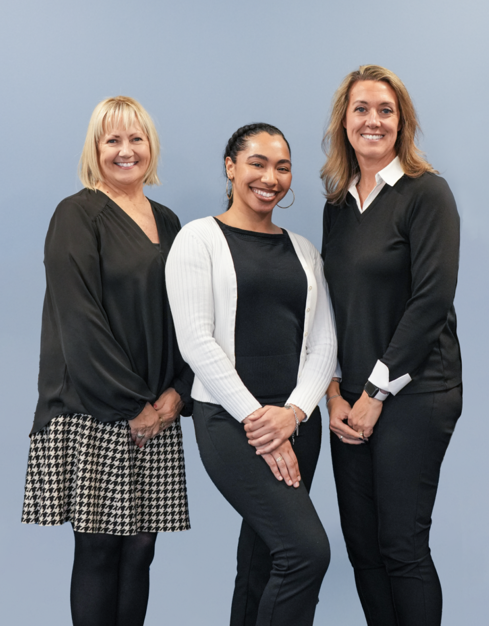 Quincy College Admissions team standing and smiling