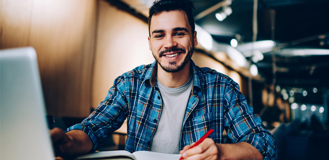 Student looking at their laptop