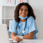 Healthcare Administration Medical Billing & Coding student sitting at a desk