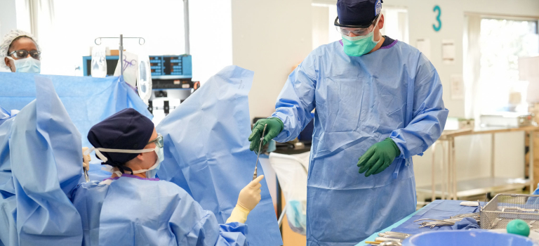 SUrgical technologists at work in an operating room.