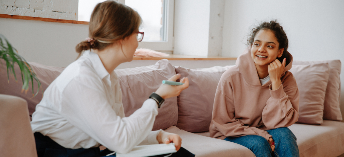 Photo of a woman in a counseling session talking to a female patient